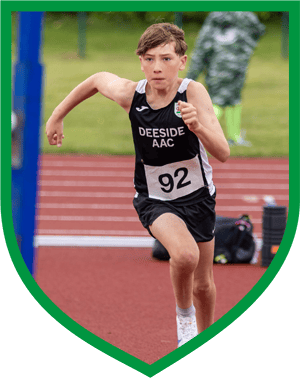 Teenage boy doing long jump in Deeside